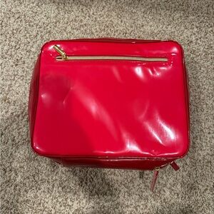 Estée Lauder Red Glossy Bag with Gold Zipper travel makeup bag